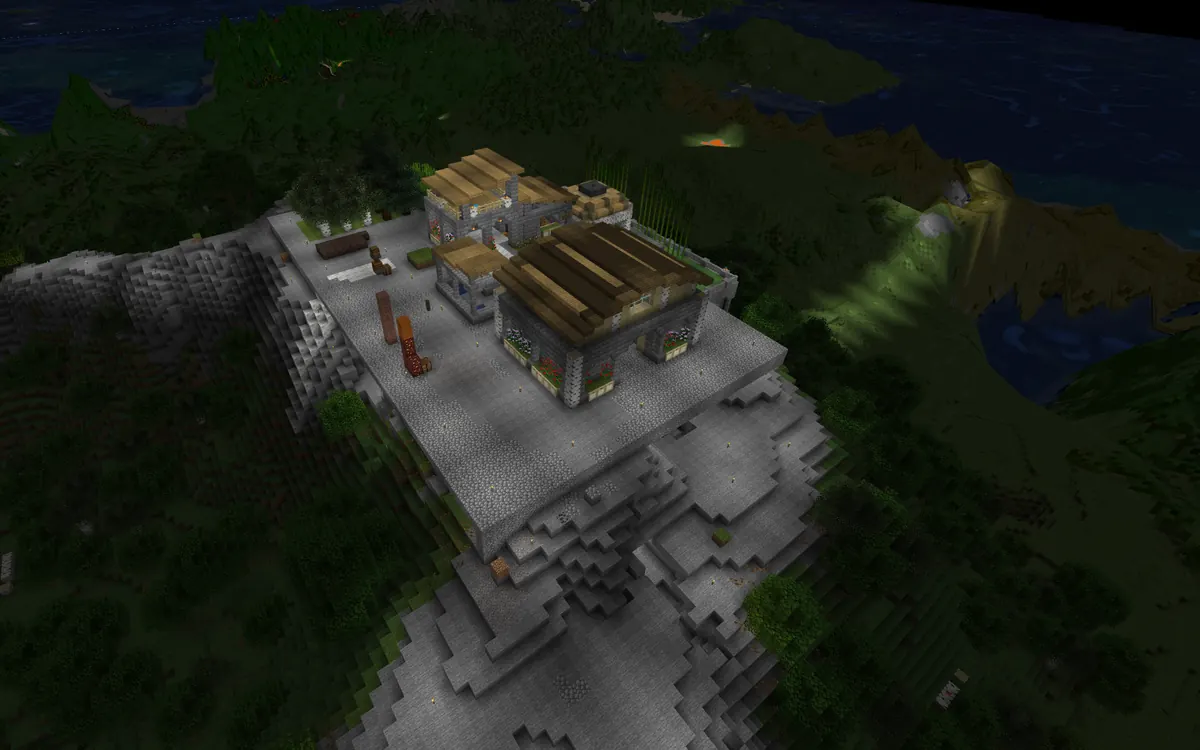 BlueMap night render of the hilltop base with its lights on